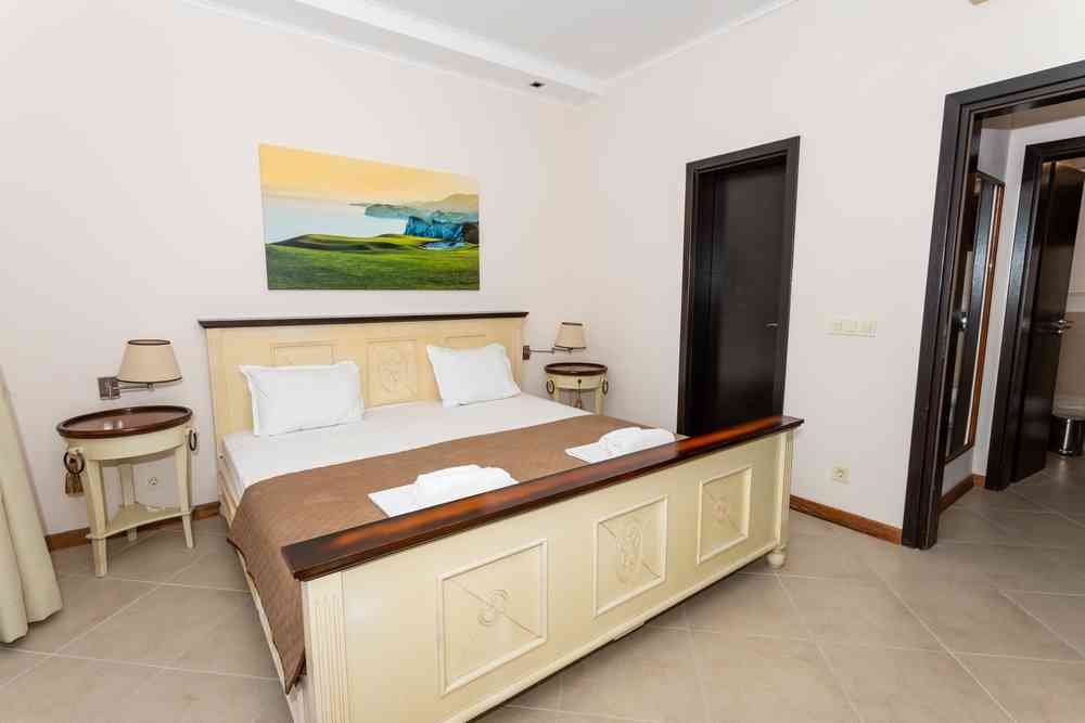 Bedroom with artwork and bedside tables