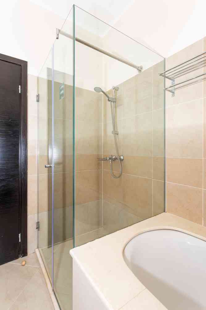 Glass shower cabin and bathtub