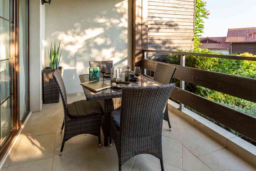 The terrace at garden level, opening onto the resort gardens