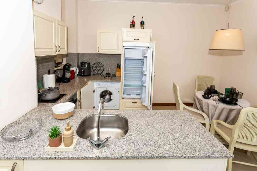 Kitchen with fridge and washing machine