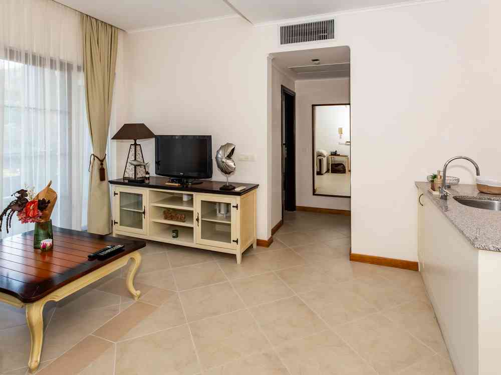 Living room with TV and kitchen area